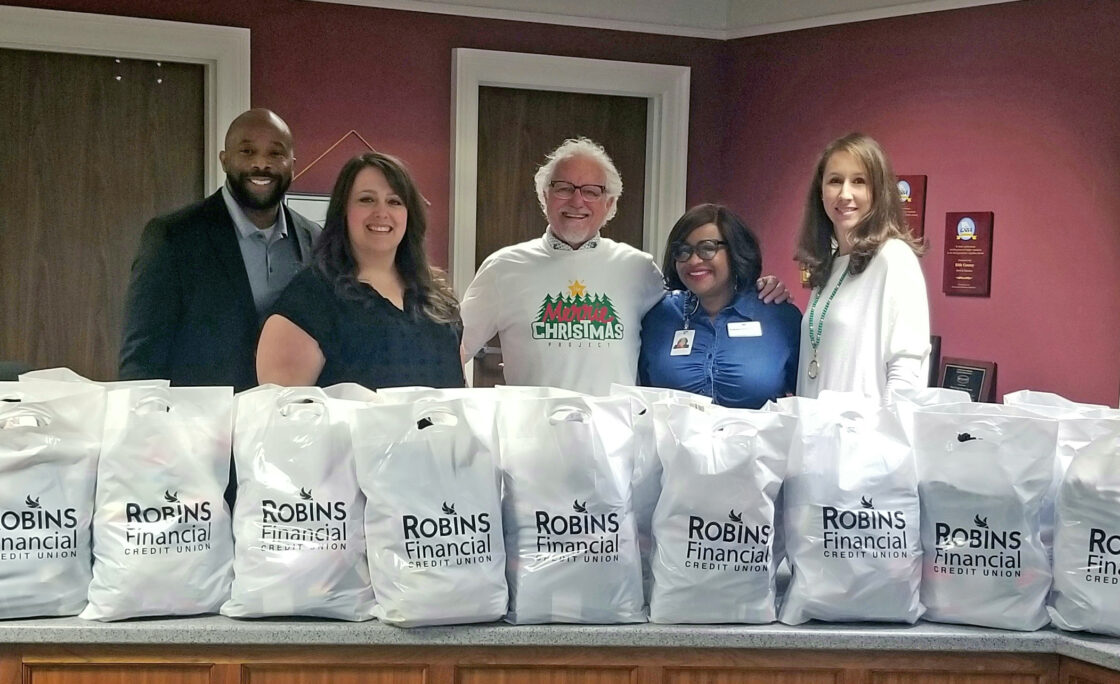 Robins Financial Credit Union Donates Socks to Local Schools