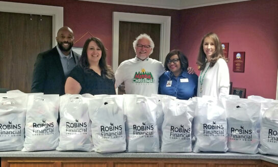 Robins Financial Credit Union Donates Socks to Local Schools