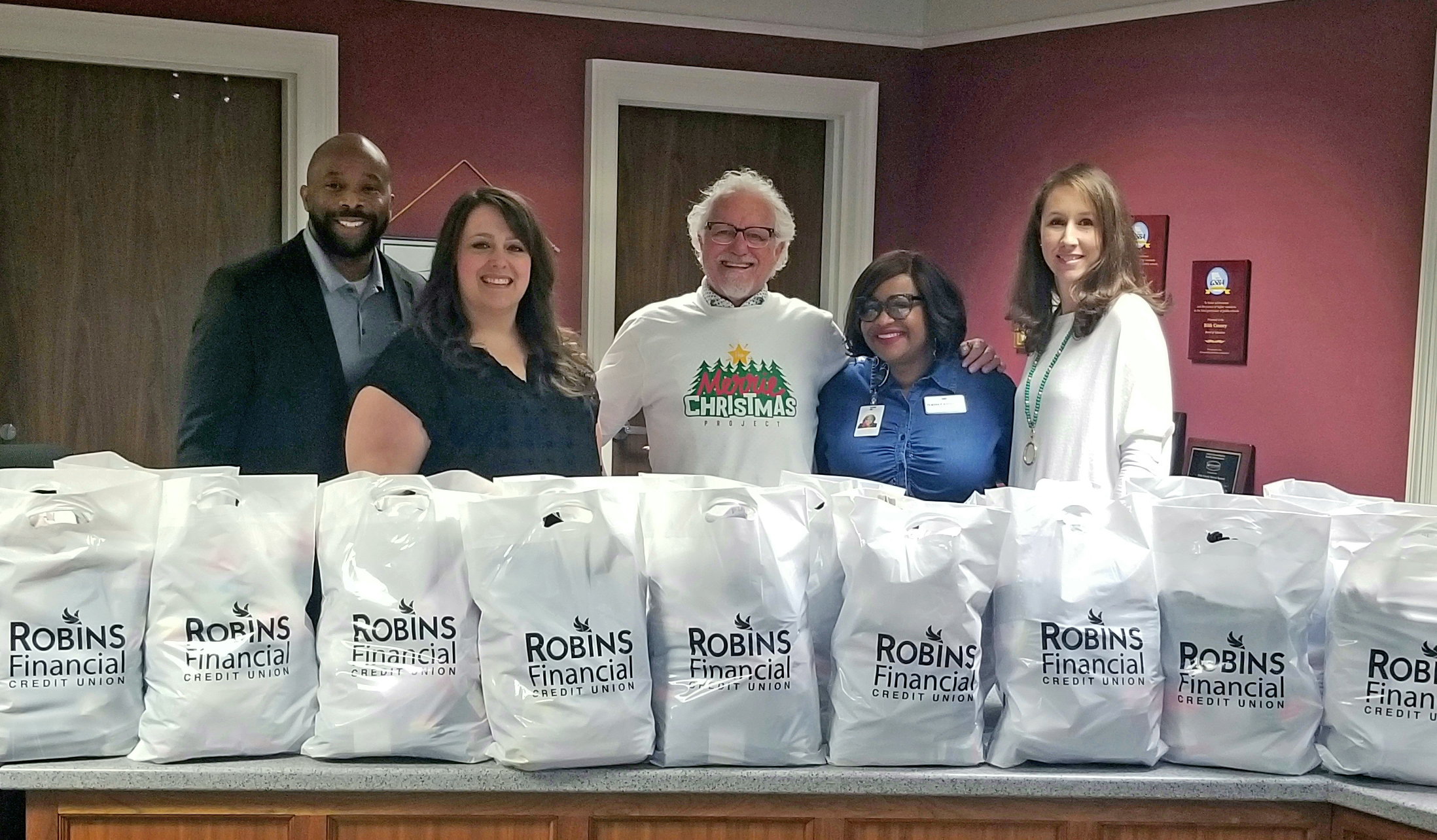 Robins Financial Credit Union Donates Socks to Local Schools