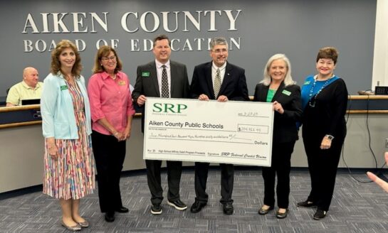 Affinity Debit Card Check Presentations Made to Local School Districts