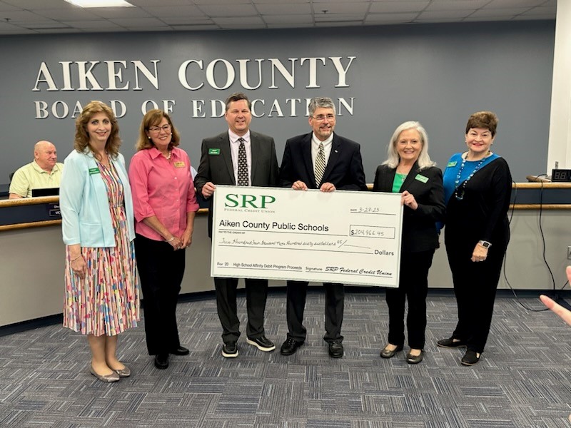 Affinity Debit Card Check Presentations Made to Local School Districts