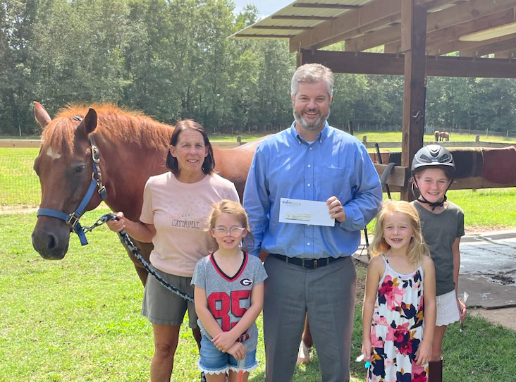 Robins Financial Credit Union Donates $1,000 to Oconee Therapeutic Riding