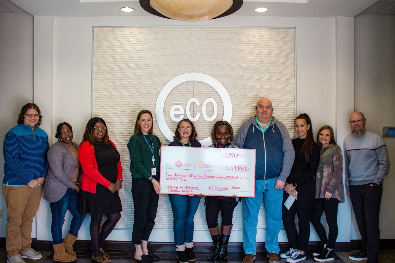 ēCO Credit Union employees present the check for Children’s of Alabama