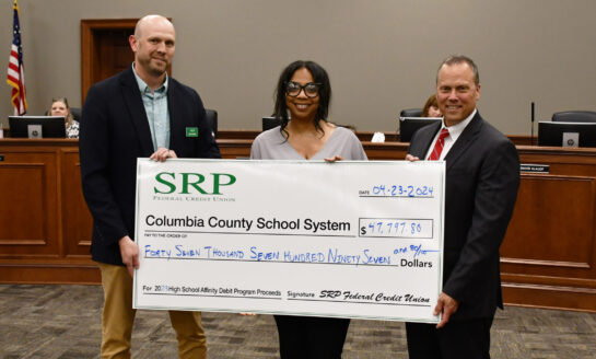 Affinity Debit Card Check Presentations Made to Local School Districts