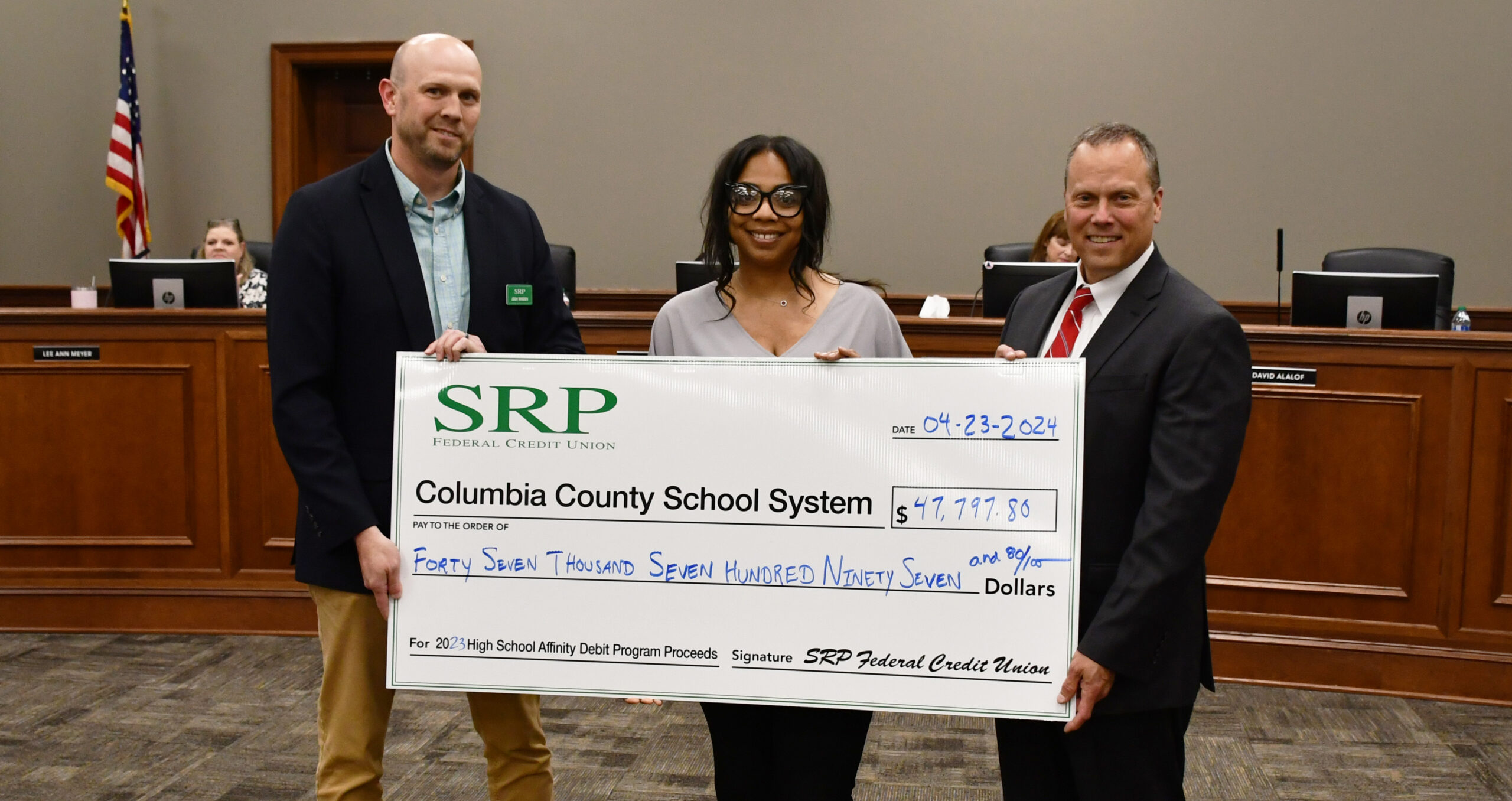 Affinity Debit Card Check Presentations Made to Local School Districts