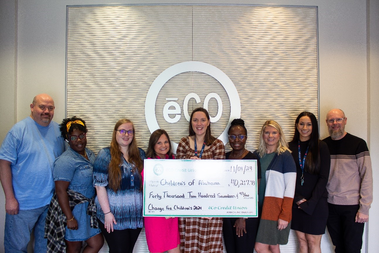 ēCO Credit Union employees present the check for Children’s of Alabama