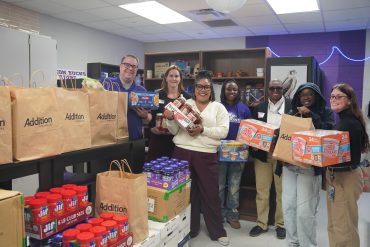 Addition Financial Volunteers Deliver More Than a Ton of Food to Restock Renovate to Educate School Pantries